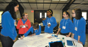 GEAR UP students collaborate on a cooperative, project-based learning assignment.