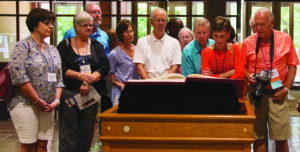 Alumni and friends gather around the SJB at a presentation during Summer Reunion.