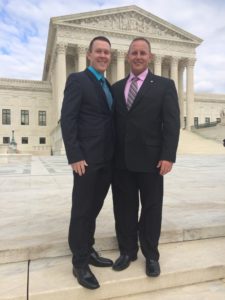 Paul Campion and Randy Johnson '91 stand on the steps of the U.S. Supreme Court.