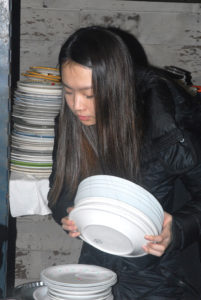 Yeongha Oh sorting dishes