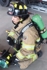 Asha Nanda in firefighter gear