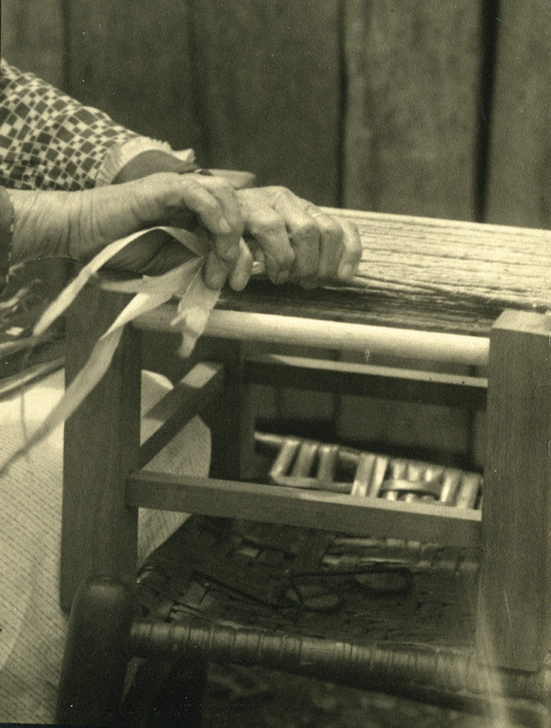 Hand weaving a corn husk chair