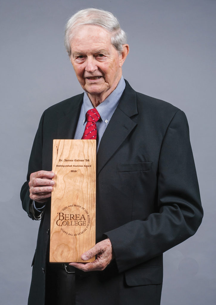 Jim Gaines poses for a photo with this award