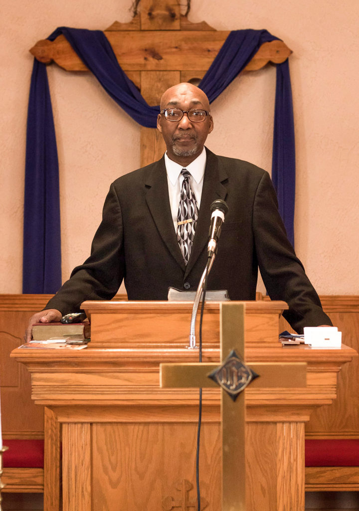 Reverend Steve Peake by the pulpit where he normally preaches.