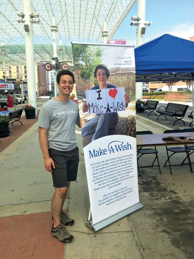 Brandon Pollock '19 with Make-a-Wish Foundation poster