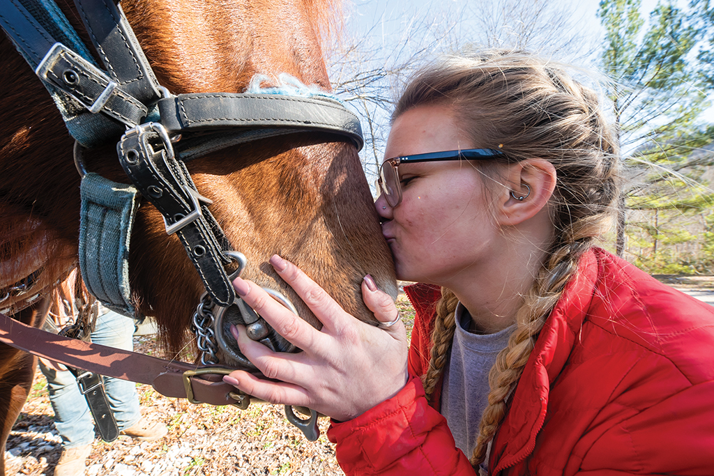 Abbie Phelps kisses horse, Willow
