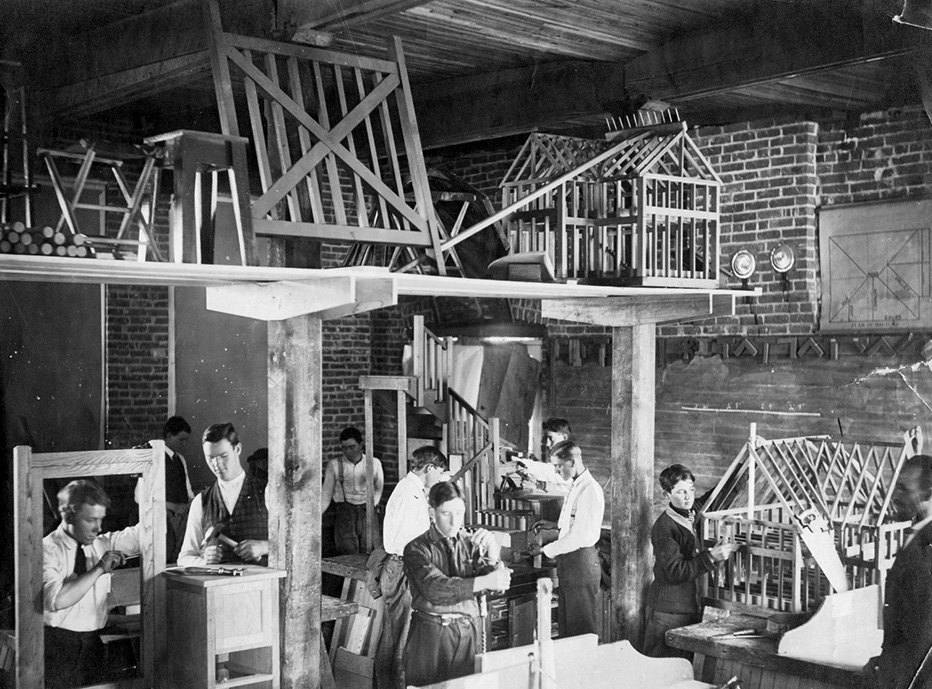 Students building small house frames at Berea College