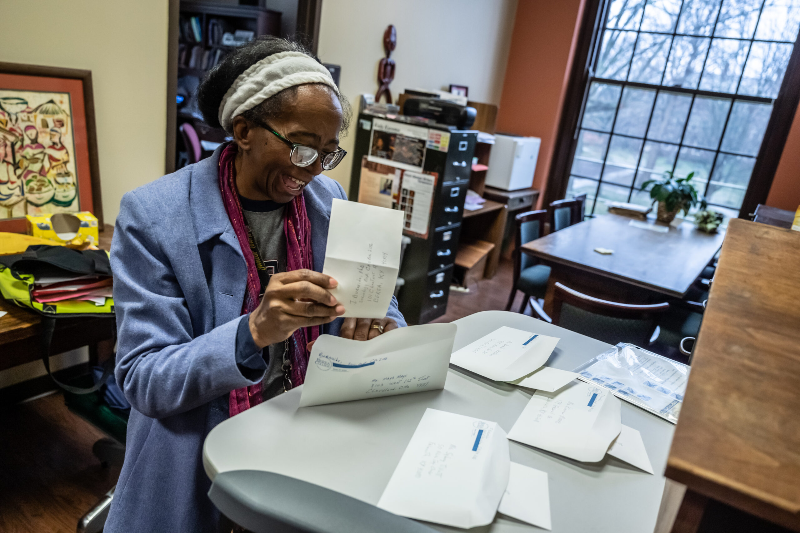 Dr. Jackie Burnside stuffs envelopes to send to her students