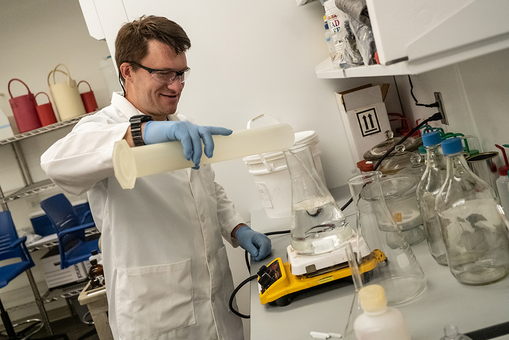 Dr. Matt Saderholm mixes ingredients to create hand sanitizer
