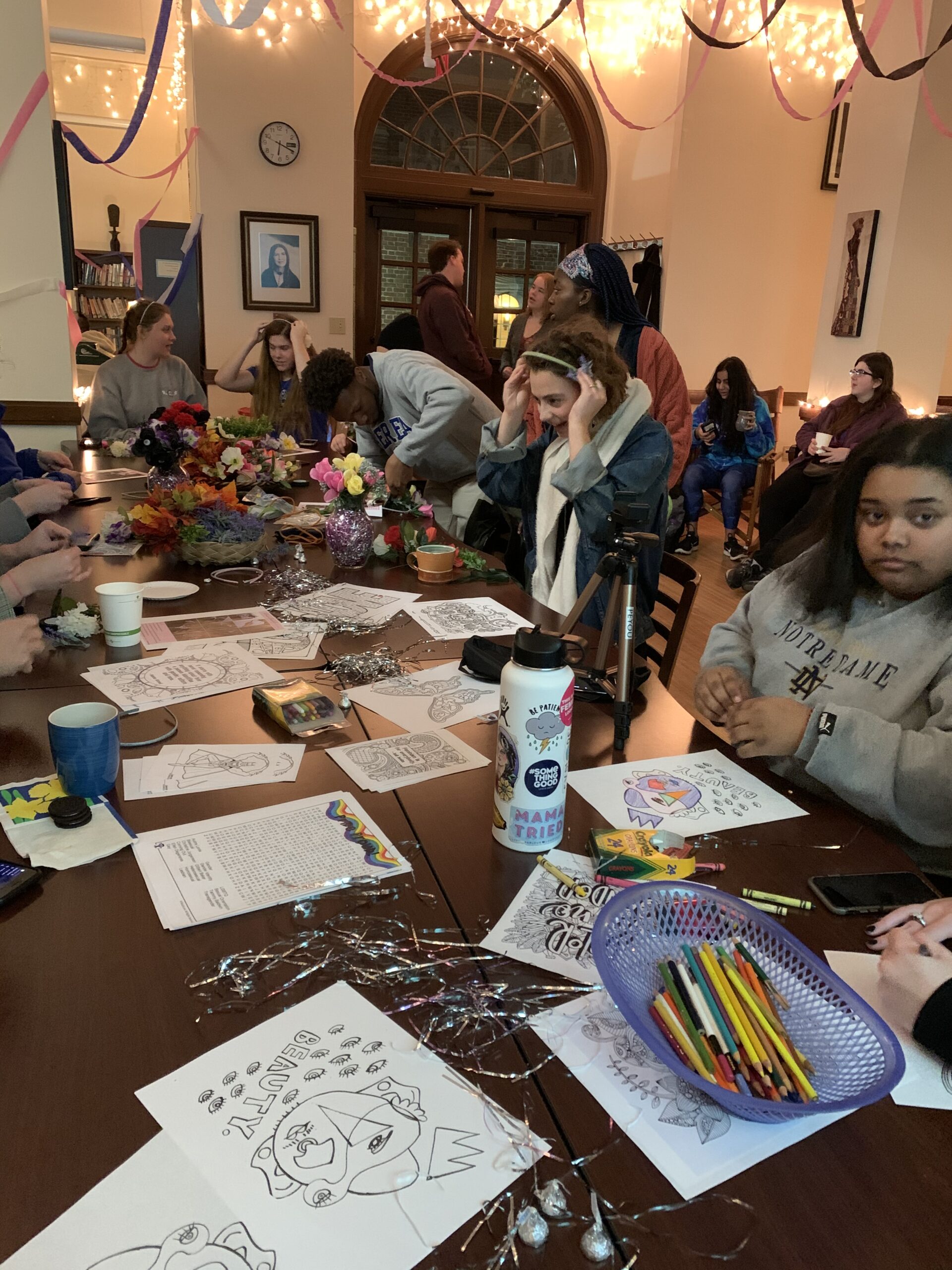 Students making crafts in the Women's and Gender Non-Conforming Center