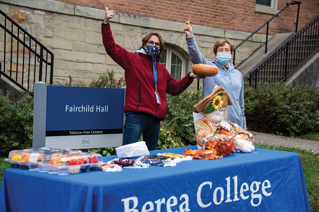 Sue Reimondo and Elaine Adams give away candy at a Berea College event