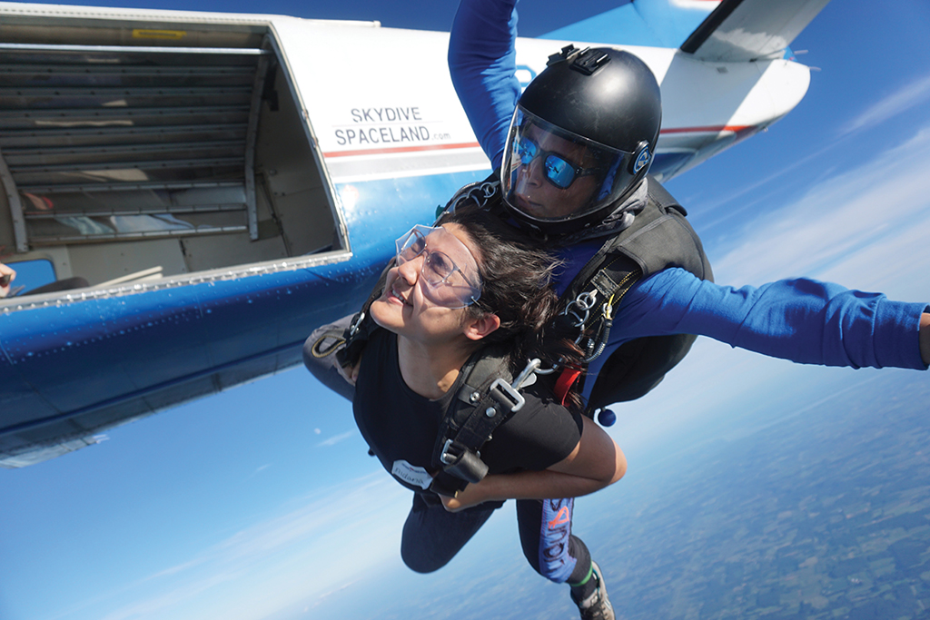 Aidana Almazova and Brandon Pollock skydiving