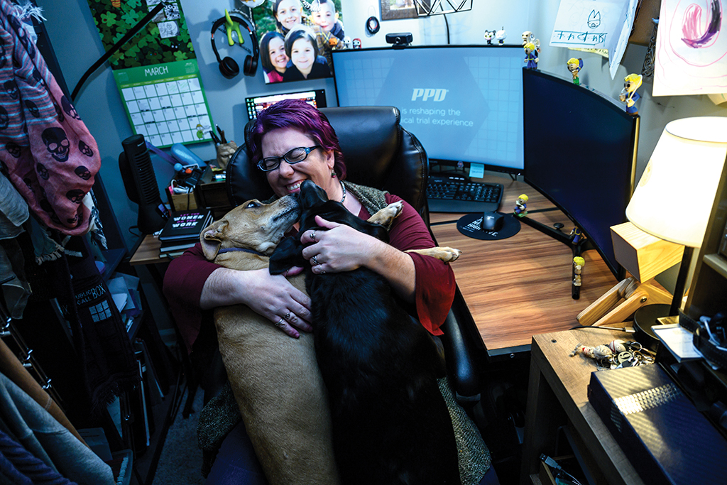 Katie Hines in her home office with her two dogs