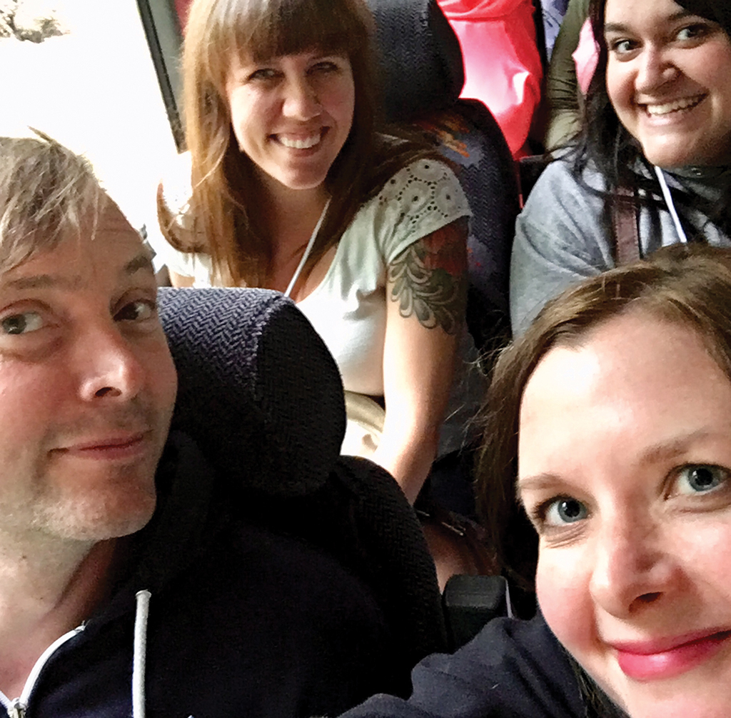 A selfie of four Berea College staff members on a tour bus