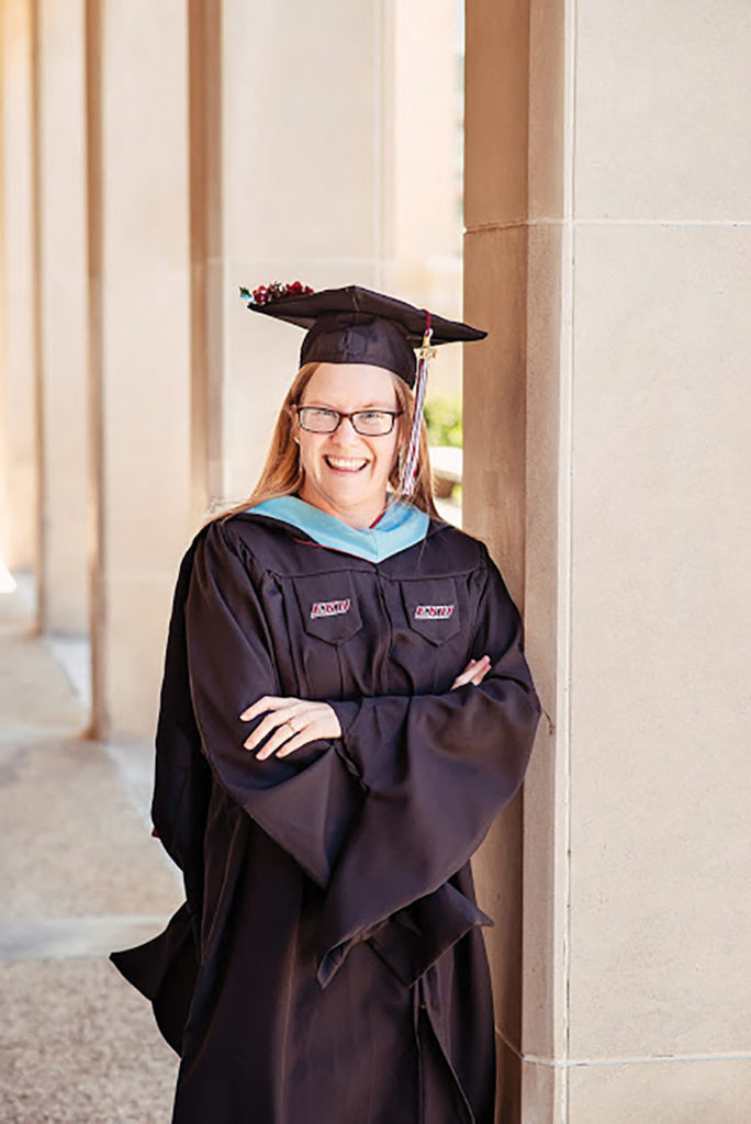 Portrait of Holly Korb Rabnott in her cap and gown