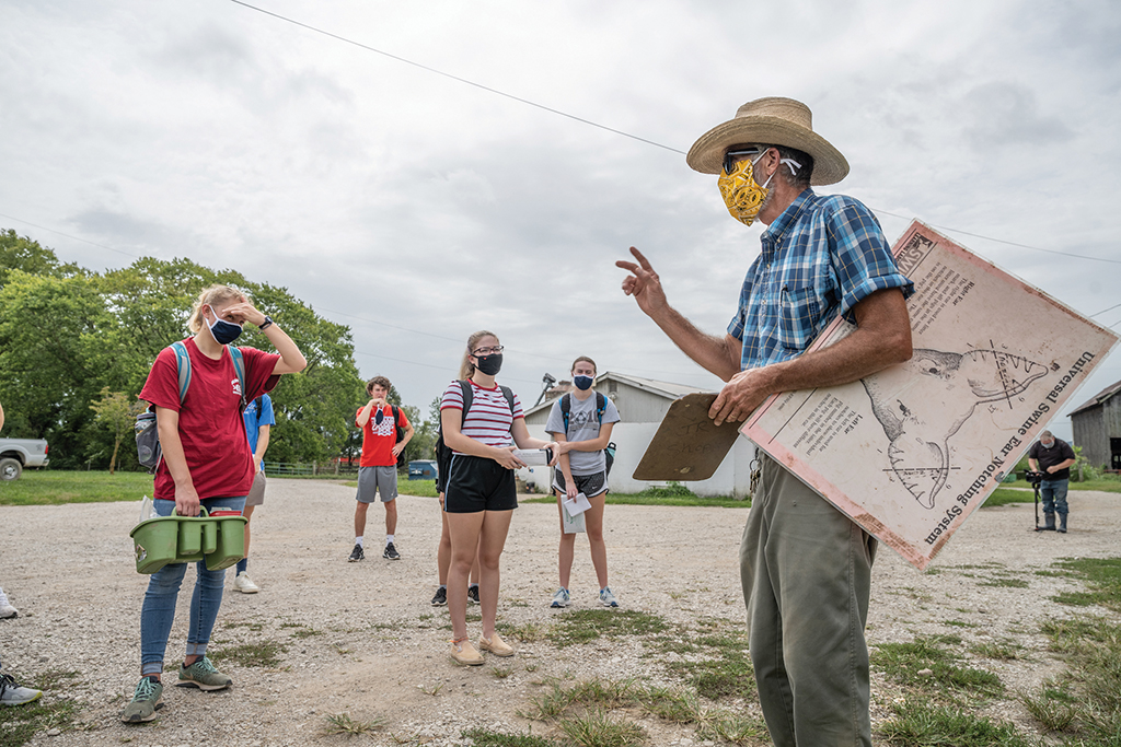 Berea College Farms manager Bob Harned teaches students on the College farm.