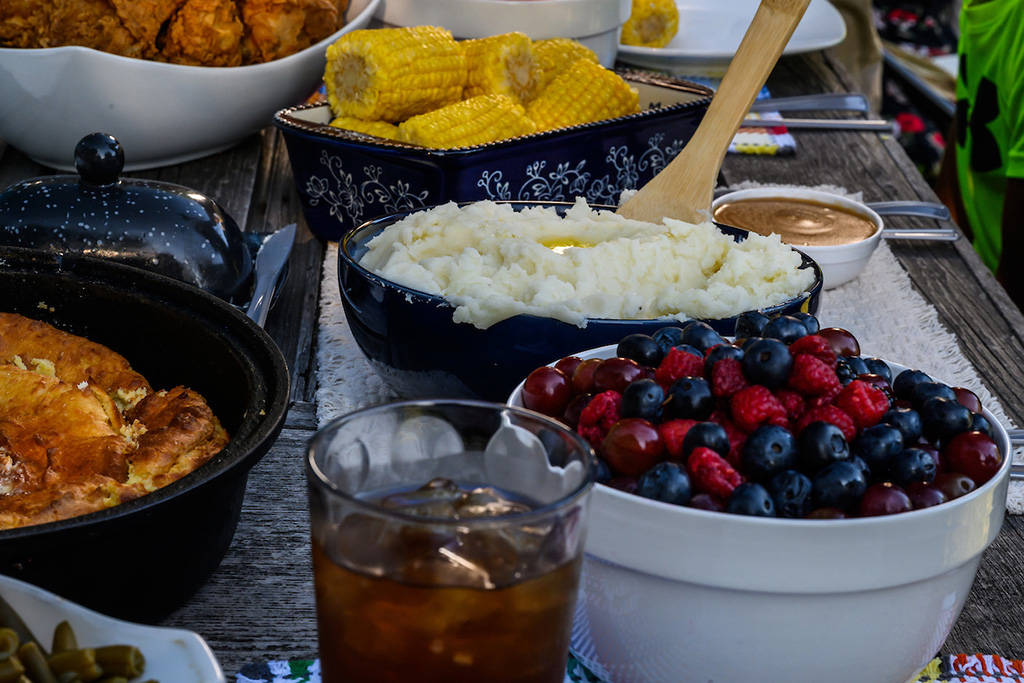 Up-close photo of a table spread with all types of southern food
