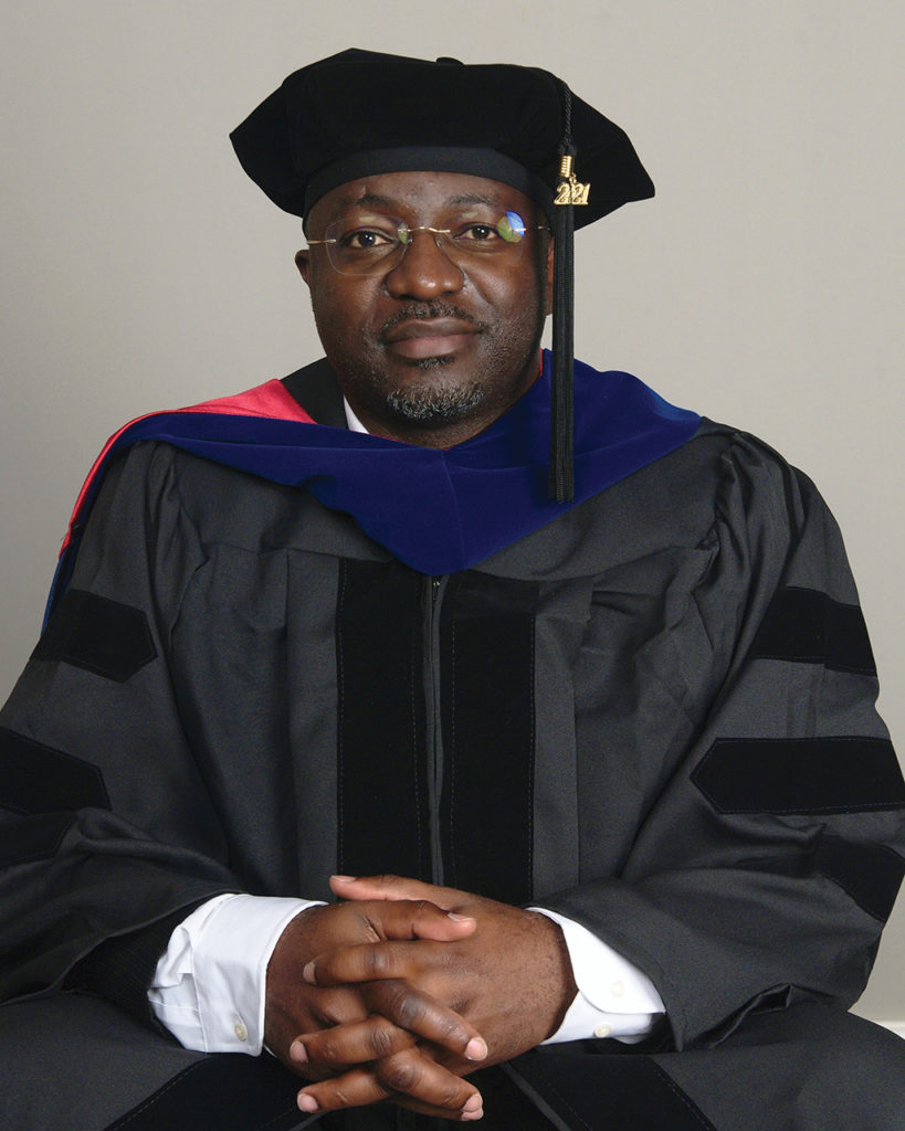 Portrait of Emmanuel Tachu in cap and gown