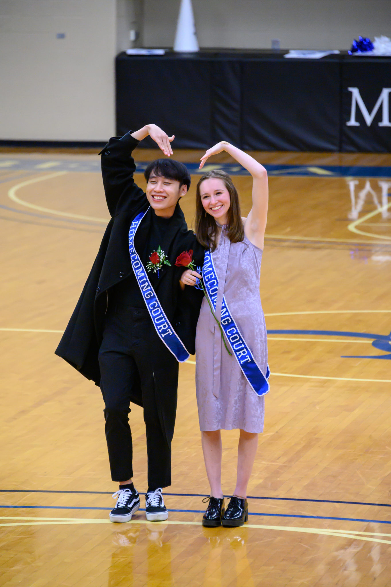 Two students pose during the Homecoming ceremony