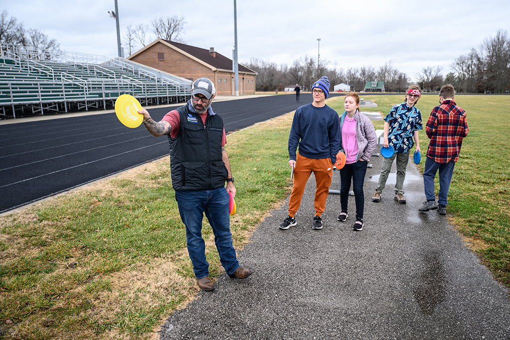 Scott Darst teaches frisbee golf to students in his 4-H Disc Golf Club