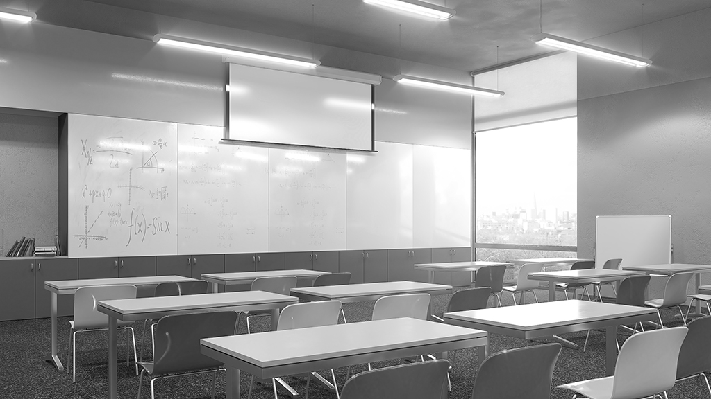 black and white image of a classroom with empty desks