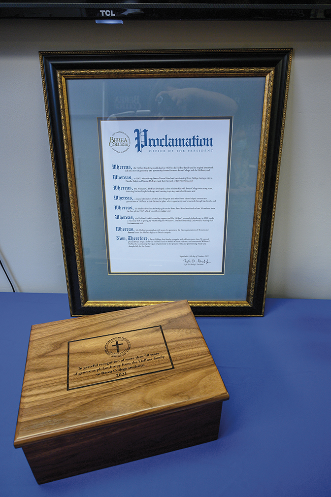 Photo of a wooden Student Craft-carved box and a framed proclamation