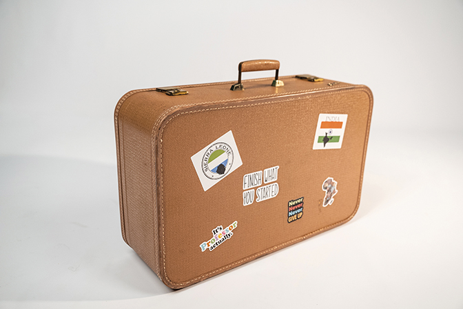 Suitcase covered in stickers