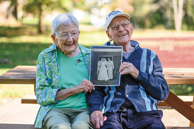 Betty and Franklin Parker hold a picture of their wedding day