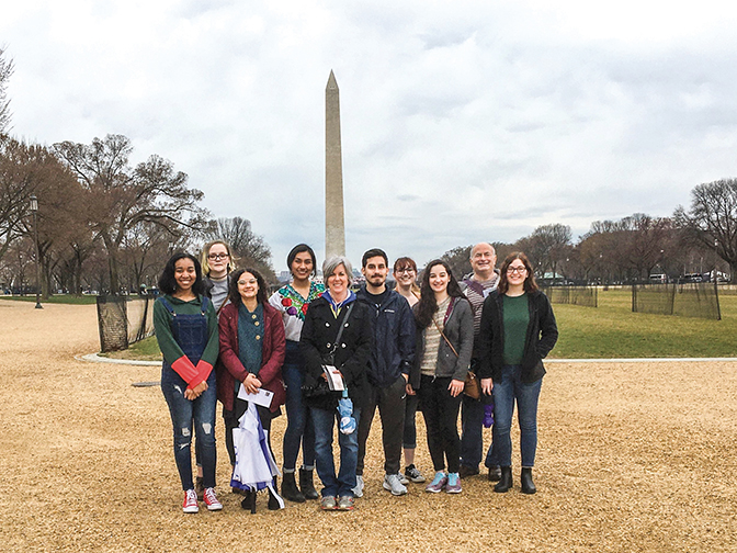 Group of students and faculty in front of the Washington Monument