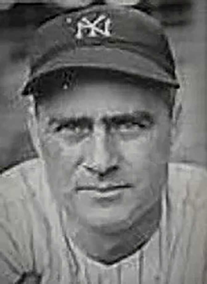 Historical Black and white photo of Earle Combs in a New York Yankees hat