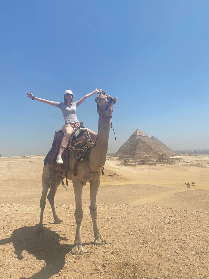 Abby riding a camel