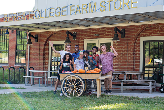 Photo of students and staff in front of the Berea College Farm Store.