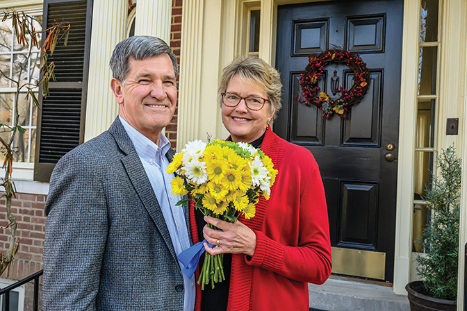 Portrait of Lyle and Laurie Roelofs, with Laurie holding flowers