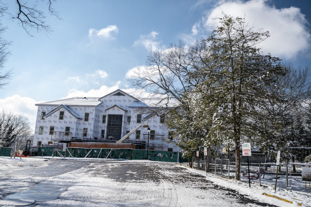 Photo of Kettering Residence Hall during construction in the snow, 2021