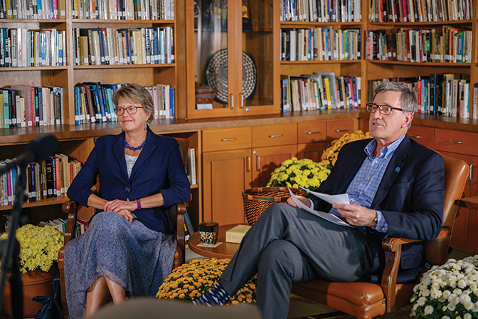 Photo of Lyle and Laurie Roelofs sitting in a library