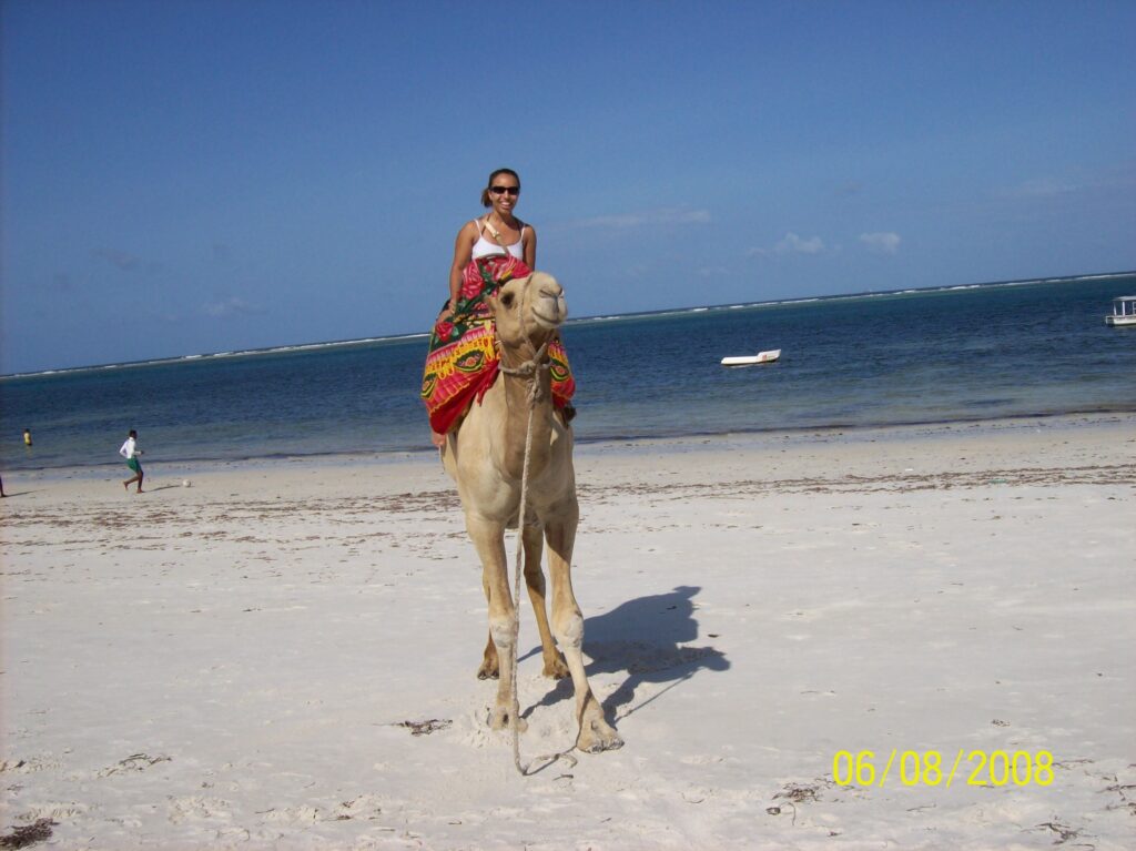 Princess Nash riding a camel in Kenya
