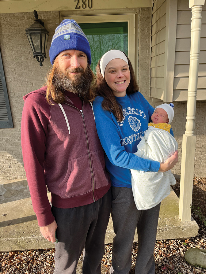 Photo of Katie and Micah Smith holding their newborn son