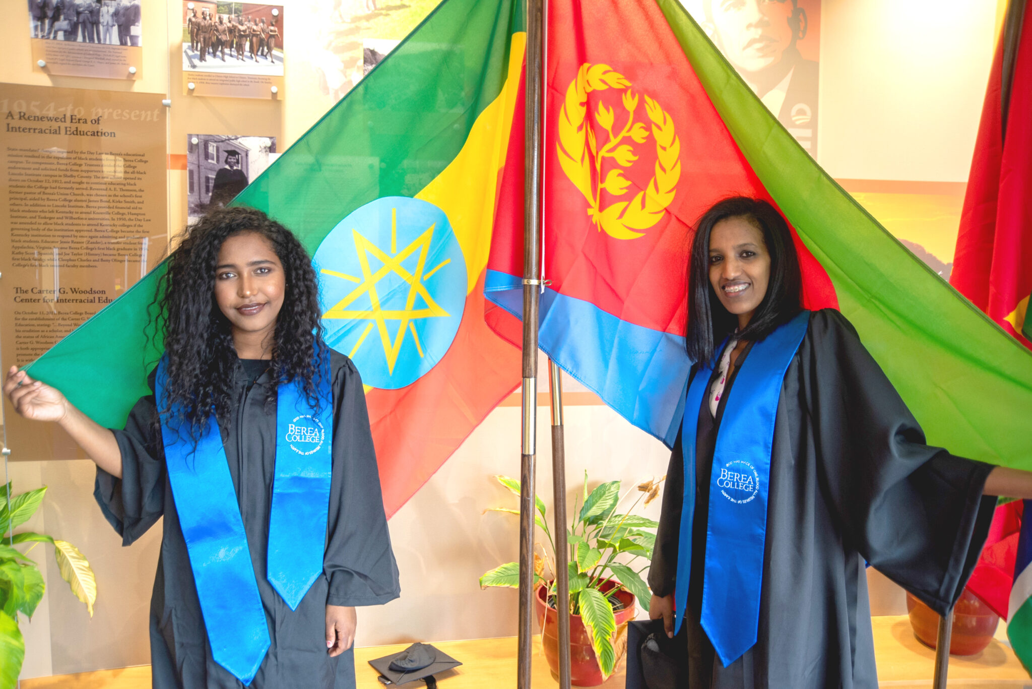 Helina Asrat ’20 (left) and Selemawit Gebremedhin ’20 stand with the flags of their home countries during a gathering of international students in March 2020. The gathering allowed the CIE to celebrate its upcoming graduates before they were sent home at the beginning of the COVID-19 pandemic.