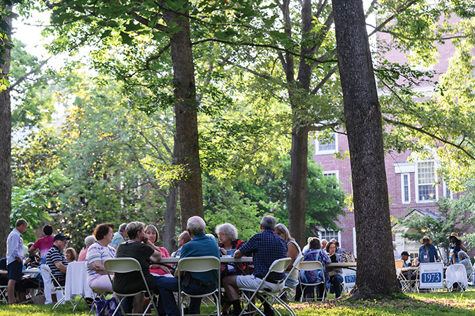 Alumni from various class years gather to eat, catch-up with old friends and await their class photos to commemorate the Summer Reunion celebration. 