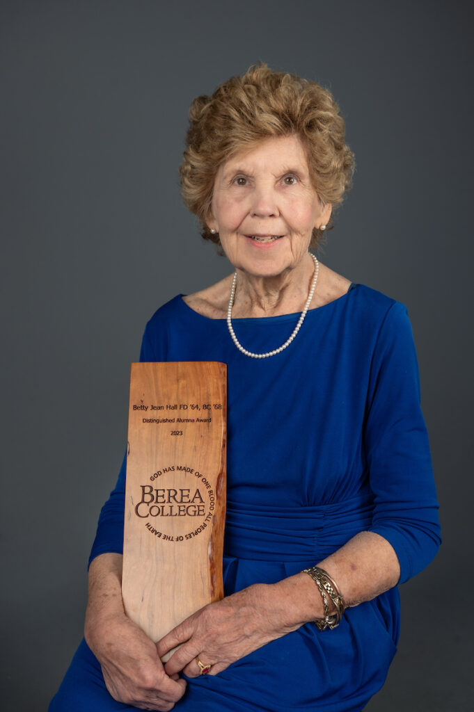 Portrait of Betty Jean Hall '68 holding a Distinguished Alumnus award
