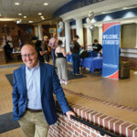 Chris Lakes '98 stands in Seabury during registration for Summer Connections