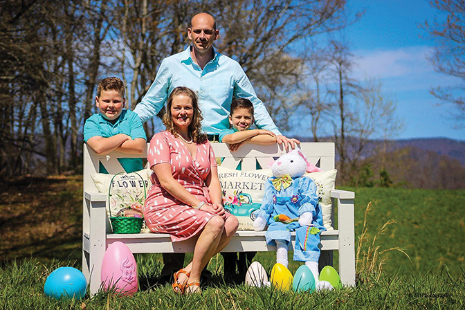 Portrait of Ashley LeAnn Daniels with her husband and two sons on Easter