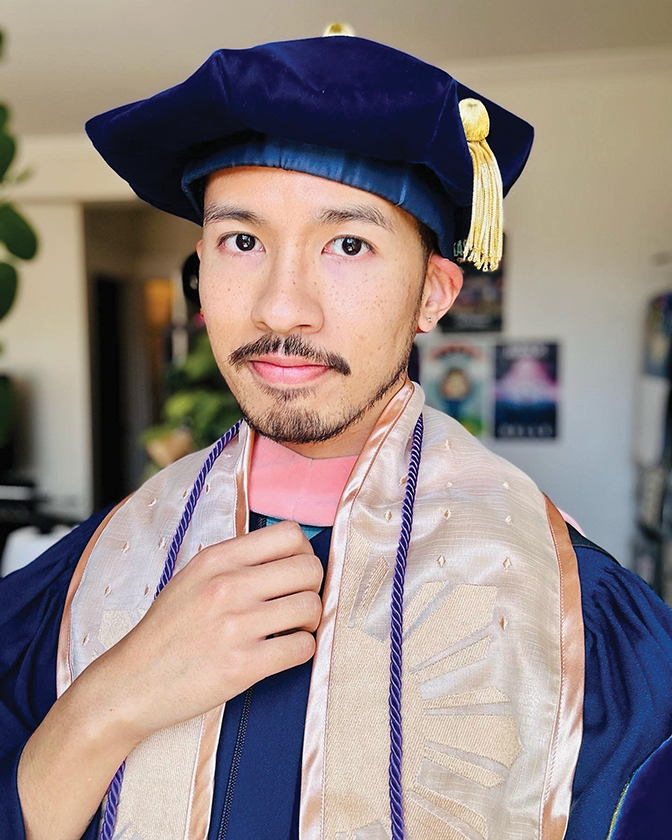 Photo of Daryl Mangosing in his cap and gown from earning his Ph.D.