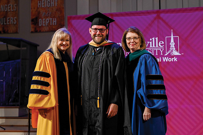 Photo of Matthew Cape standing with representatives of Campbellsville University at his graduation