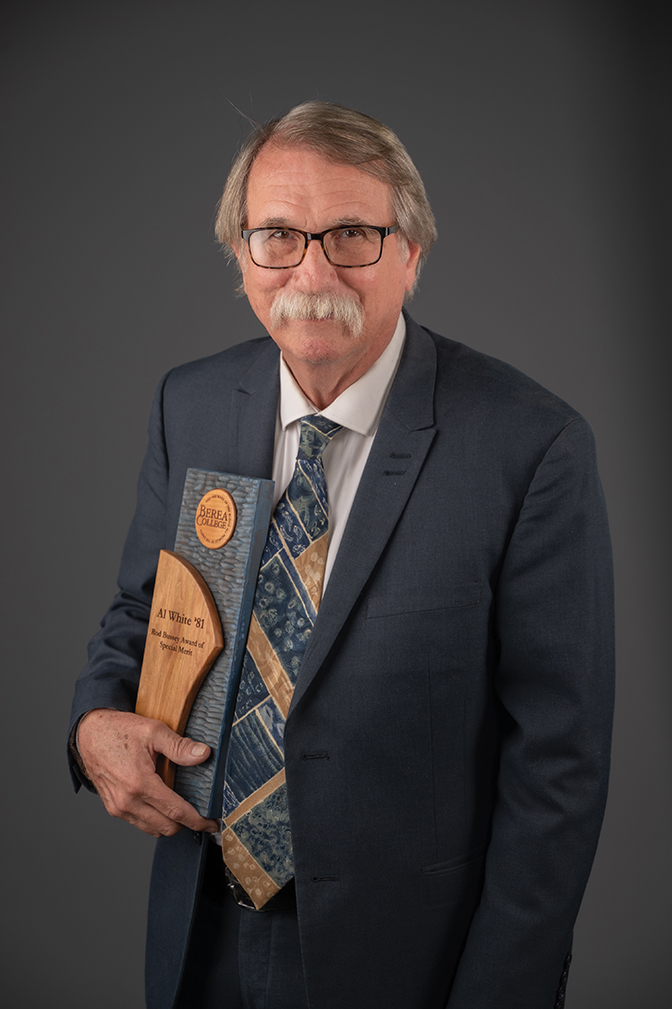 Portrait of Al White holding his Rod Bussey Award of Special Merit