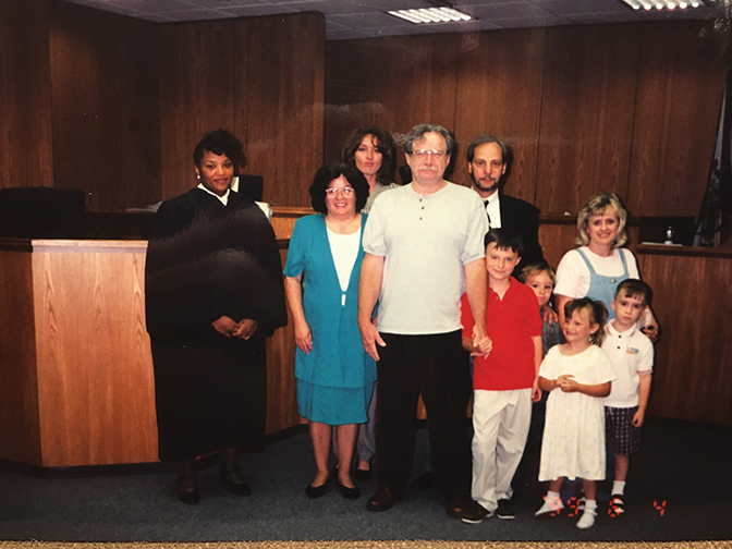 picture of the Johnston family in court on the day the adopted two of their children.