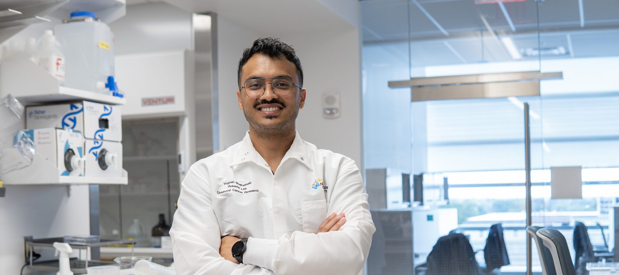 Portrait of Yogesh Budhathoki '22 standing in a lab.