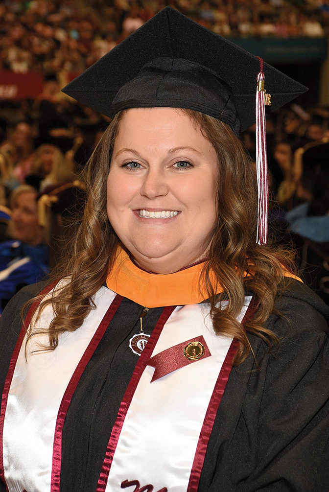 Photo of Amanda Beers Caldwell in full commencement regalia