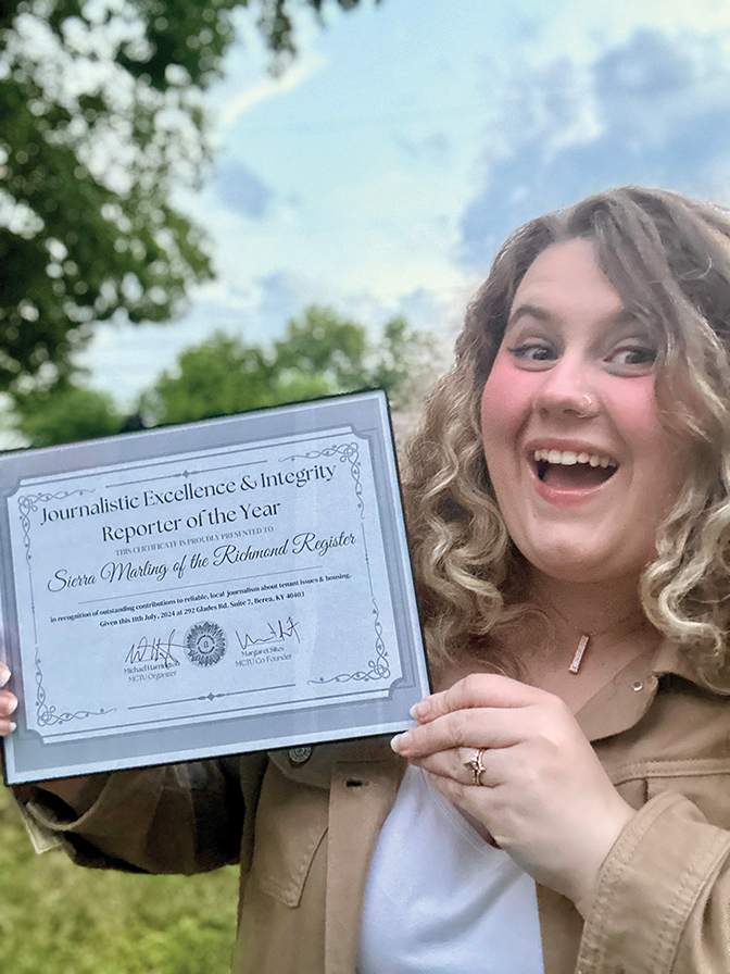 Photo of Sierra Marling holding a certificate