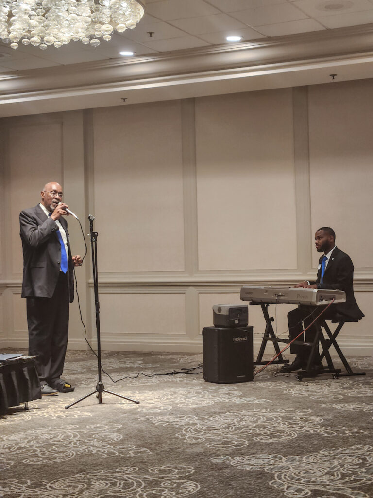 The music leader and keyboard player present special music to those gathered